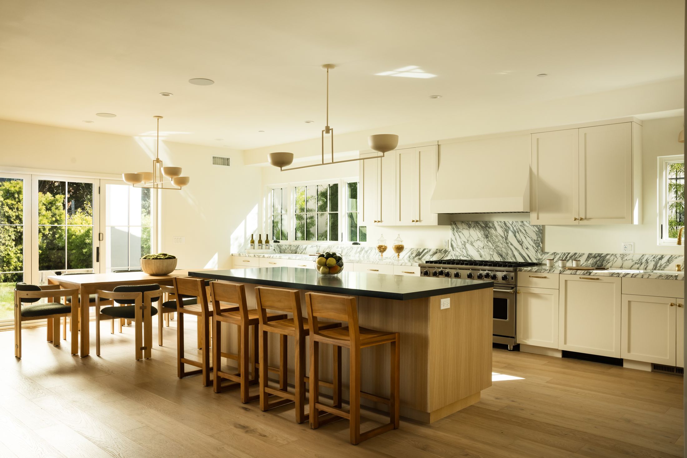 Kitchen with white oak island and honed black stone counters, a StyleLab project